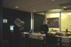 Sharakmir manning the reception desk while the monitor-head guy walks by. Rumour has it it was Walder of Syntax Society, BTW.